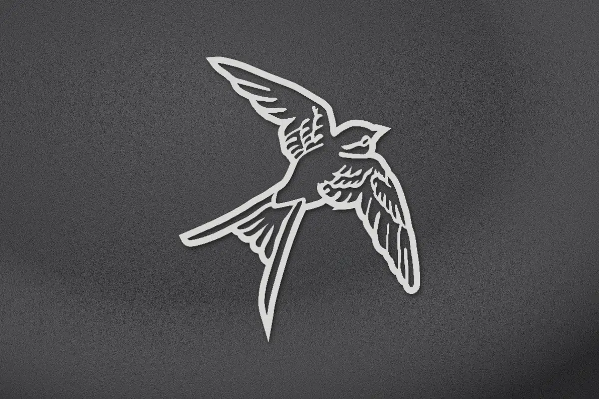 Swallow in flight engraved on black granite