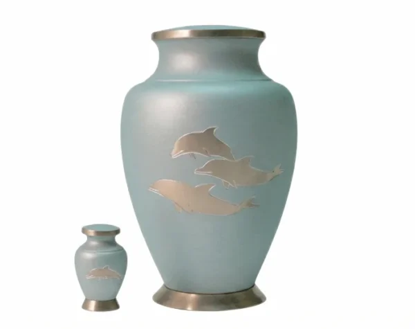 Ocean Breeze Metal Urn MU156, pale blue green metal urn with three silver dolphins and a matching keepsake urn
