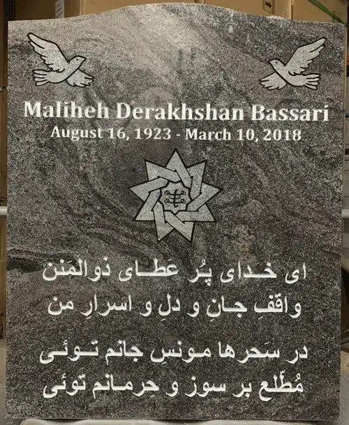 Paradiso granite serpentine top headstone with two doves and a nine pointed star emblem