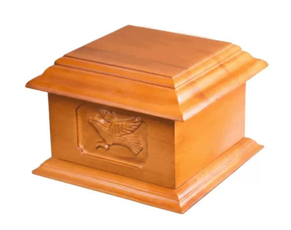 Soaring Dove Wood Urn WU103, light honey wood box urn with a carved dove in flight on the front panel